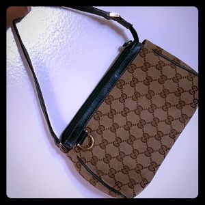 Gucci cosmetic/wrist bag gently used